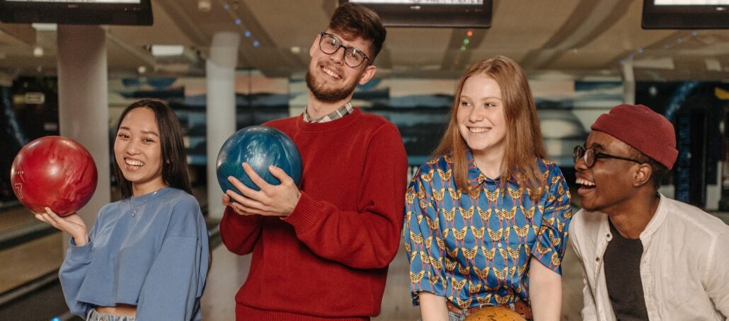 group of young adults bowling