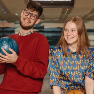 group of young adults bowling